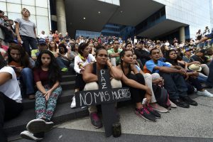 Opposition activists protest against the government of Venezuelan President Nicolas Maduro, in Caracas on May 17, 2017. The United States on Wednesday warned at the United Nations that Venezuela's crisis was worsening and could escalate into a major conflict similar to Syria or South Sudan. / AFP PHOTO / JUAN BARRETO